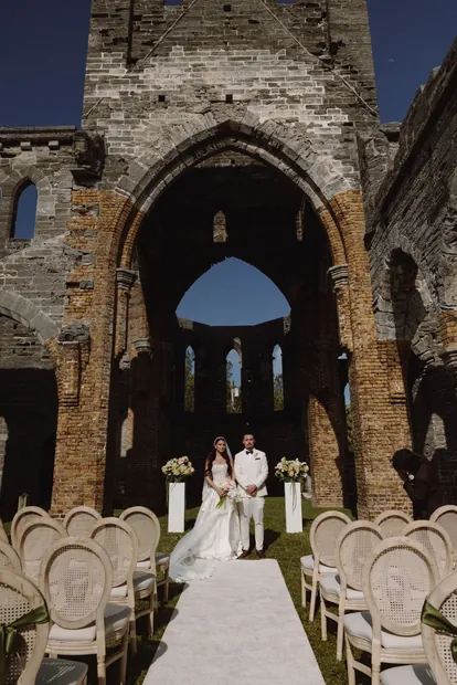 The aisle inside a roofless stone church