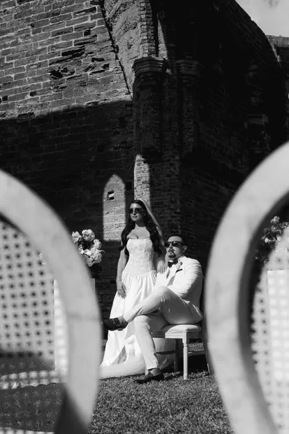 The couple framed through the back of a chair