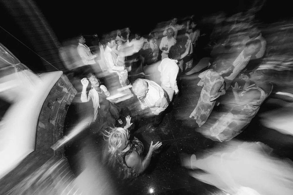 Black and white motion blur across a dance floor