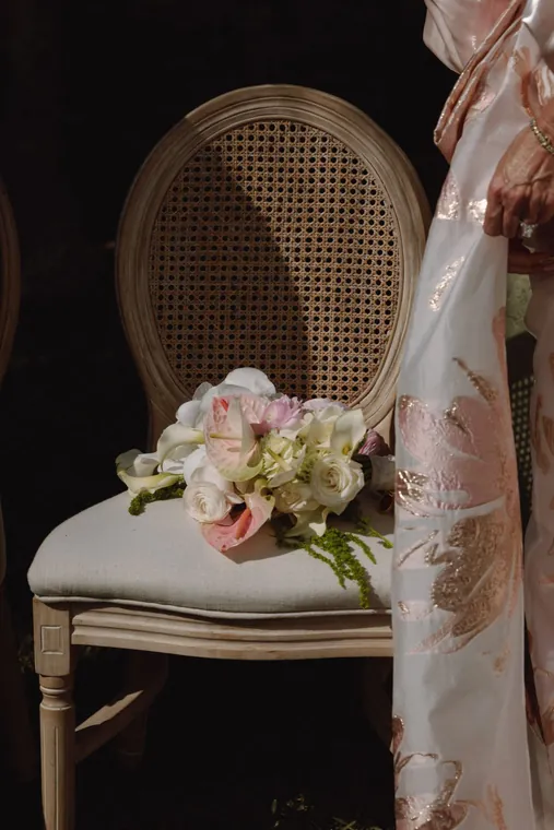 A chair with a bouquet resting on it